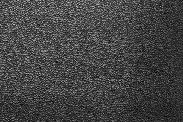 couro preto e um fundo texturizado. - car leather hide seat - fotografias e filmes do acervo