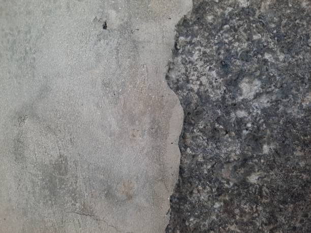 istock Unfinished dark gray concrete wall texture for background 1495798153