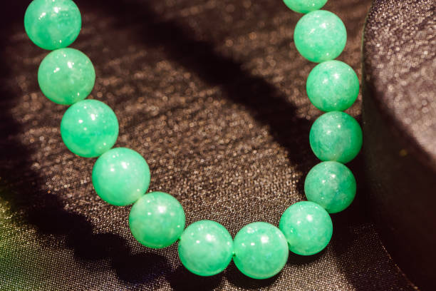 String of round beads from green nephrite stone