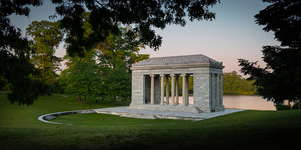 Serene sunset landscape at Temple to Music Pavilion and meadow forest park at Roger Williams Park in Providence, Rhode Island