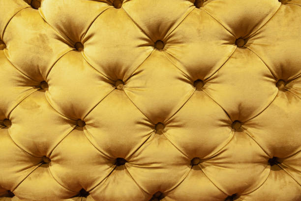 istock Soft yellow fabric sofa with sewn-in buttons. 1495801941