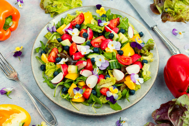 istock Colorful summer salad with edible flowers 1495802142