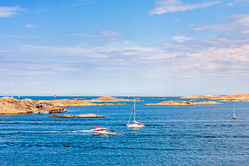 Rocky archipelago with boats a sunny summer day