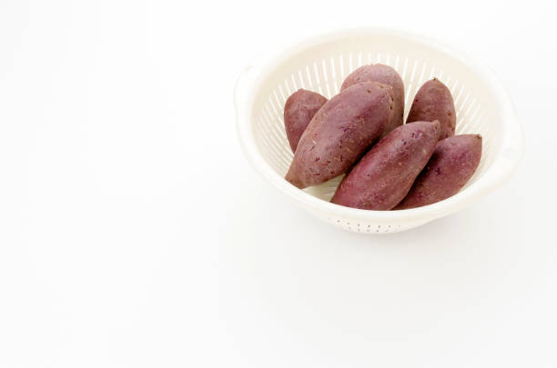 purple yam in white plastic colander