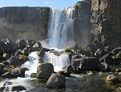Öxarárfoss is a waterfall in Þingvellir National Park, Iceland. It flows from the river Öxará over the Almannagjá