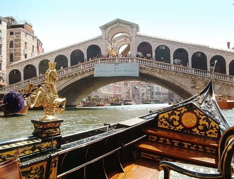 The Rialto Bridge (Italian: Ponte di Rialto) is the oldest of the four bridges spanning the Grand Canal in Venice, Italy.