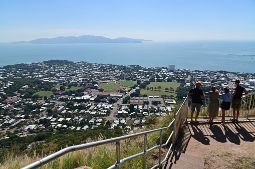 Townsville, Qld - May 10 2023:Tourists look at aerial view of Townsville Queensland, Australia the largest city in North Queensland and imported port due to its proximity to trading countries in Asia.