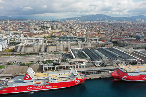 Marseille is the second most populous city in France, with 870,321 inhabitants. The image shows the modern part of the city with ferries captured during autumn season.