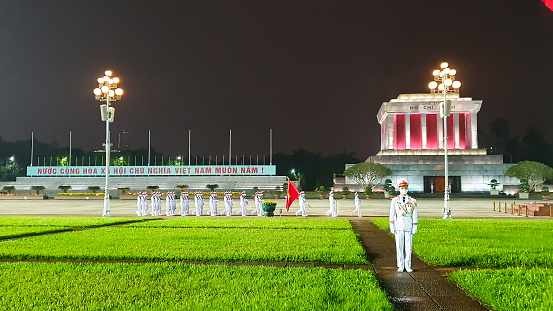Hanoi, Vietnam - April 11, 2022 : The Lowering Of The Flag Ceremony In Front Of Mausoleum Of President Ho Chi Minh At Night. This Place Is One Of The Most Visited Attraction In Hanoi.