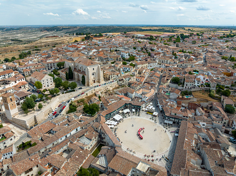 Aerial panorama of the main square and Church of Our Lady of the Assumption of Chinchon, province of Madrid. cataloged as beautiful towns in Spain
