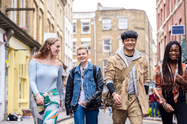 istock Multiracial group in teens and 20s exploring Brick Lane 1495811472
