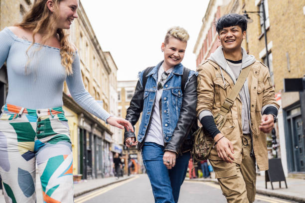 istock Cheerful Gen Z friends exploring Brick Lane in East End 1495811473