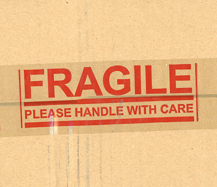 fragile please handle with care brown corrugated cardboard box