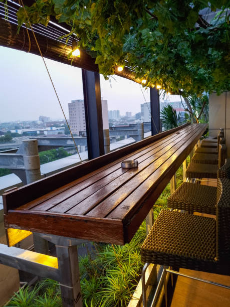 istock Table setting on roof top restaurant with megapolis view, Jakarta Indonesia. 1495820953