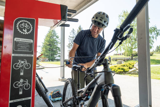 istock Mountain biker preparing his bike on the go 1495824003