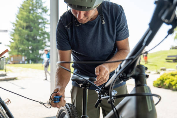 istock Mountain biker preparing his bike on the go 1495824018