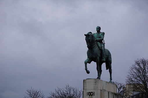 Statue of man on horse in the city of Paris.