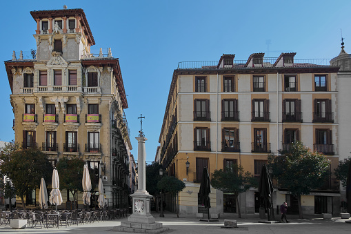 Madrid, Spain - June 04, 2023: Square de Ramales in Madrid, Spain with the glossary column and its commemorative plaque to Diego Velazquez 1599 1660.