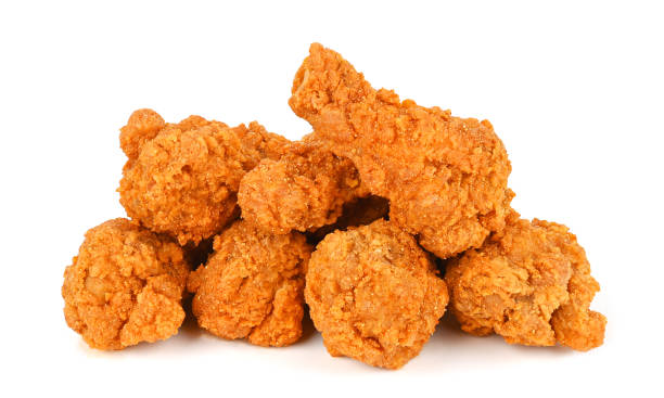 Heap of fried spicy chicken isolated on white