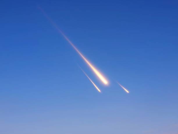 istock Fireballs in the clear blue sky. Meteorites in the daytime. 1495840030