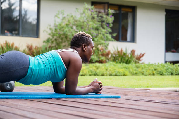istock Black woman working out at home overlooking her garden 1495840408