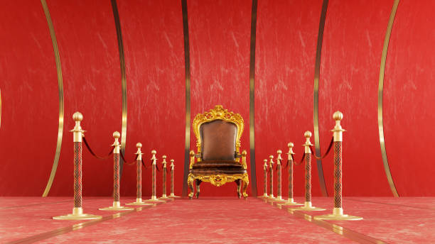 istock golden Barrier Rope leading to a red king throne on a red background 1495840427
