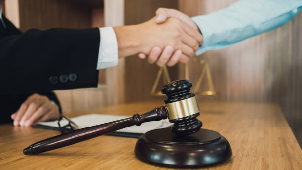 istock Lawyer preparing to sign a contract reading documents at meeting 1495841127