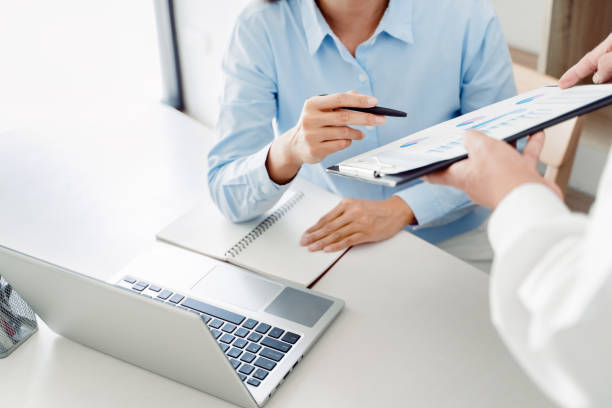 istock Business partners discussing brainstorming ideas at meeting business project 1495844432