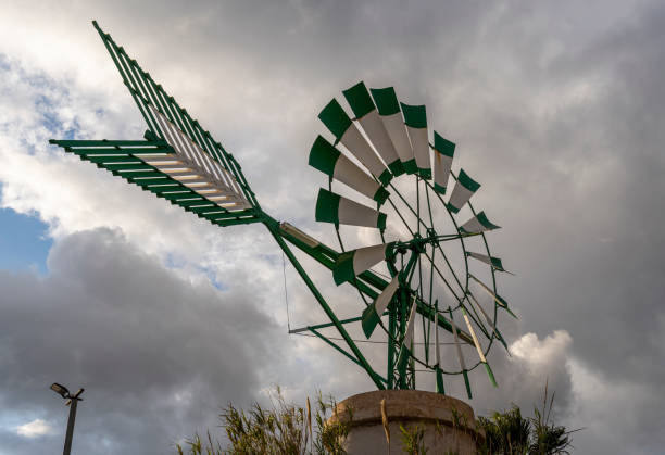 Green and white windmill typical of Mallorca