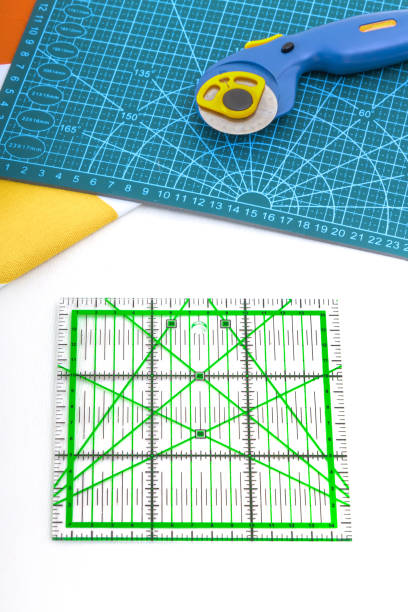 istock Tailor's ruler against the background of fabric cuts. View from above 1495853154