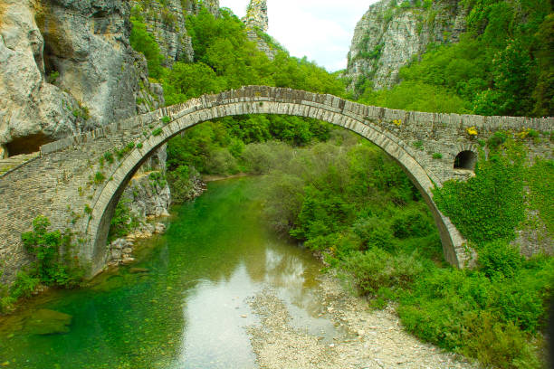 ancient bridge at the Zagoria in Greece ancient bridge at the mountains of Zagoria in Greece at05.23.2023 zagori stock pictures, royalty-free photos & images