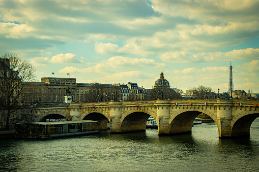 Wide shot view of the Seine river in downtown Paris during the day