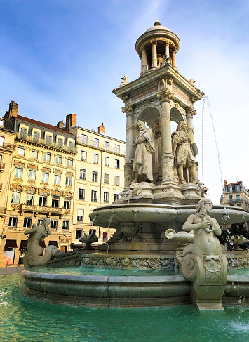 Munich, Germany - Jun 18, 2023: Fish Fountain, Fischbrunnen in front of the New New Town Hall at Marienplatz, the historic center square in Munich, Germany