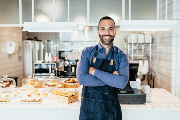 istock Portrait of entrepreneur in bakery with apron 1495865171