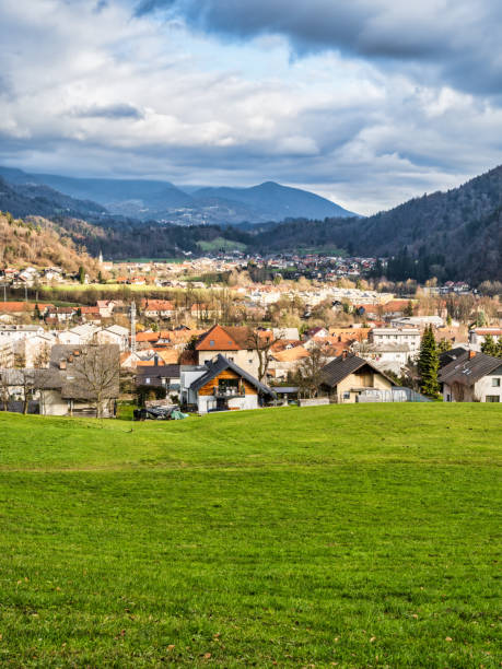 istock Vertical shot of Kamnik village valley and mountain with rolling hills during a dramatic cloud sky, Kamnik, Slovenia 1495867621