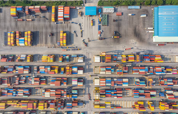 istock Top view Logistics and transportation of Container Cargo ship and Cargo plane with working crane bridge in shipyard at sunrise, logistic import export and transport industry background 1495880746