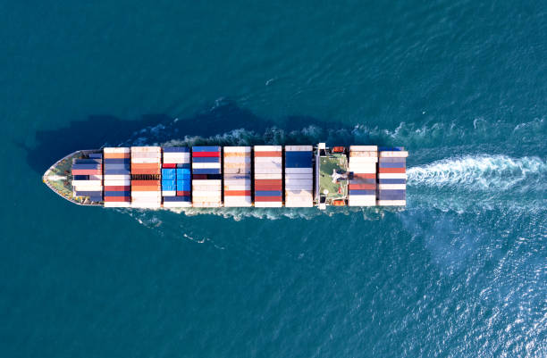 istock Top viewContainer ship loading and unloading in sea port, Aerial view of business logistic import and export freight transportation by container ship in harbor, Container loading Cargo freight ship, Dubai 1495880748