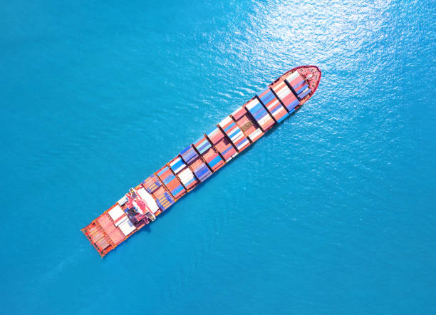 istock Top view of International Container ship loading, unloading at sea port, Freight Transportation, Shipping,  Vessel. Logistics, import export, Transportation. Global transport business. 1495880783