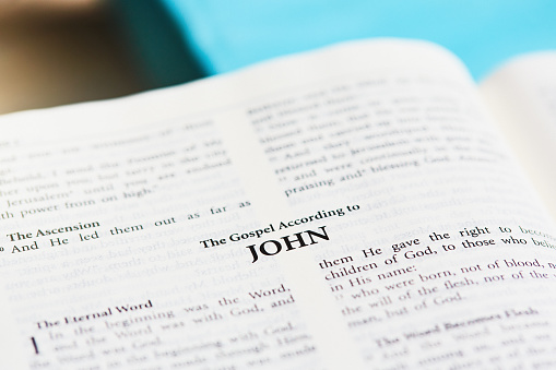 Page of the Christian Bible with the title of the Gospel According To John.