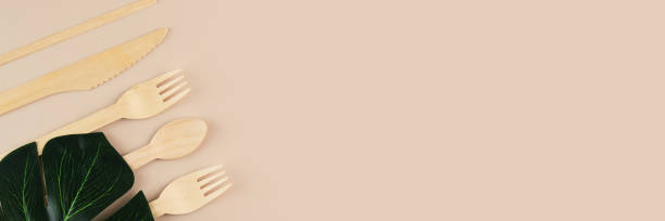istock eco friendly disposable kitchenware utensils banner, Biodegradable wooden spoons,forks and knifes for sustainable dining solutions 1495886103
