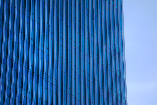 underside panoramic and perspective view to steel Tiffany blue glass high rise building skyscrapers, business concept of successful industrial architecture