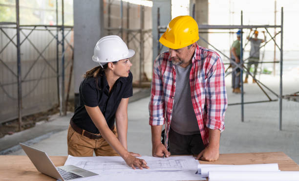 istock Female Architect And Male Construction Worker 1495887301