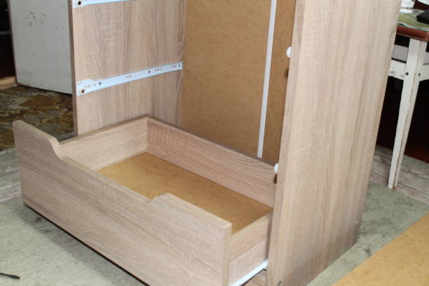 istock Assembling dresser furniture for storing clothes 1495887860