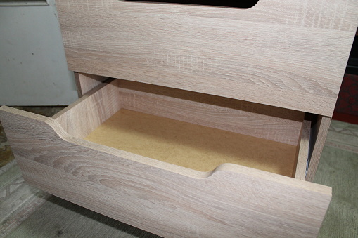 Assembling dresser furniture for the storing clothes