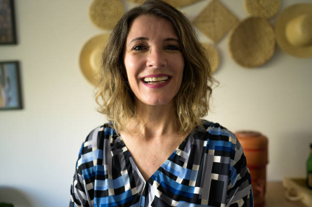 istock A woman at home happy and smiling 1495888971