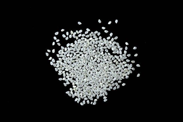 istock a pile of white rice on a black background 1495891123