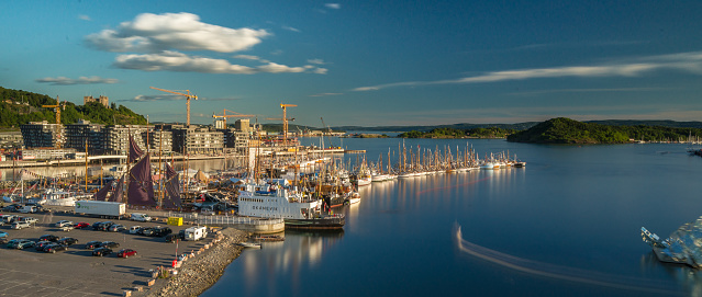 Oslo, Norway - July 19 2014: Long row of wooden fishing boats at Bjørvika.