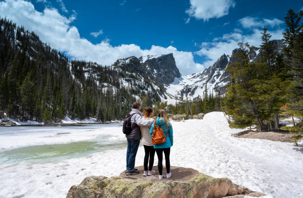 istock Family enjoying beautiful view on spring mountain hiking trip. 1495892607