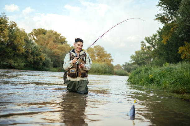 5,700+ Man Holding Fishing Rod Stock Photos, Pictures & Royalty-Free Images  - iStock