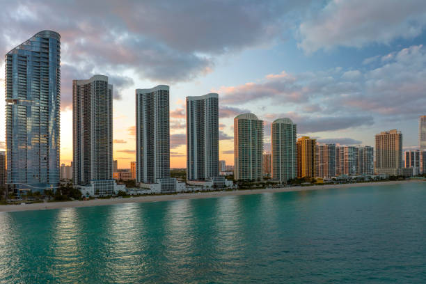 istock Expensive highrise hotels and condos over sandy beachfront on Atlantic ocean shore in Sunny Isles Beach city at sunset. American tourism infrastructure in southern Florida 1495893617